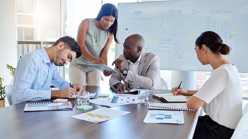 Sales team meeting in a conference room and having a discussion