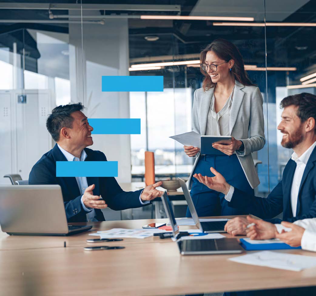 two men and a woman with laptops at a meeting